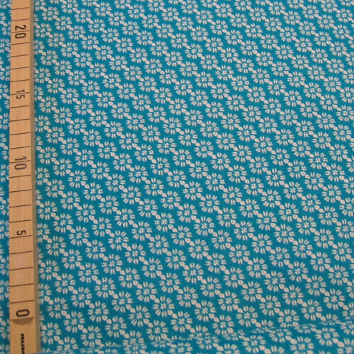 Druckstoff blau-grün mit stilisierten Blüten